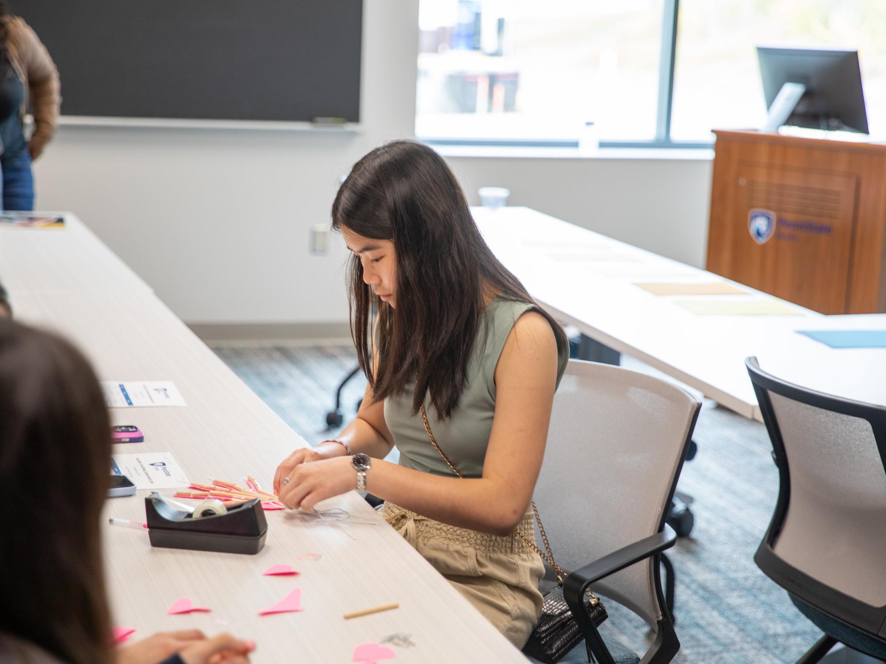 Student works on hand art project