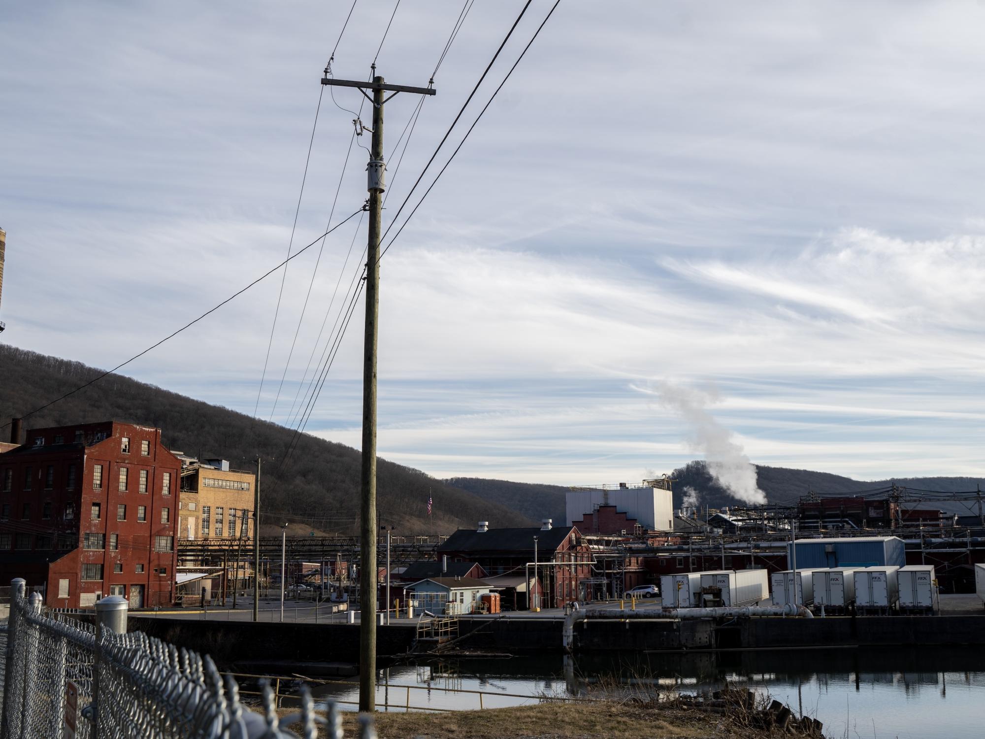 Town sitting on a river bank, blue skies