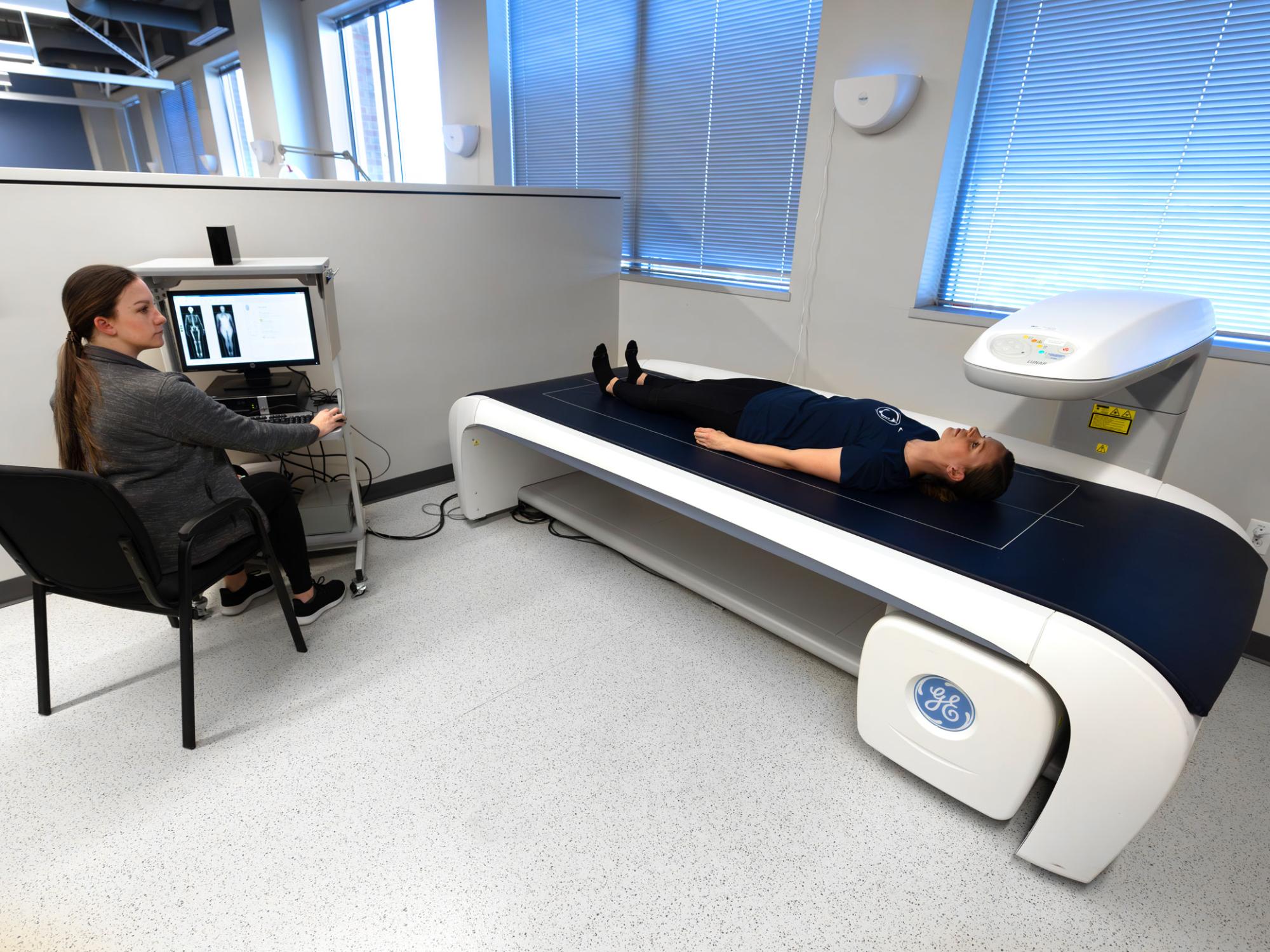 ERC manager conducts a DXA test on a patient to measure bone density and body composition