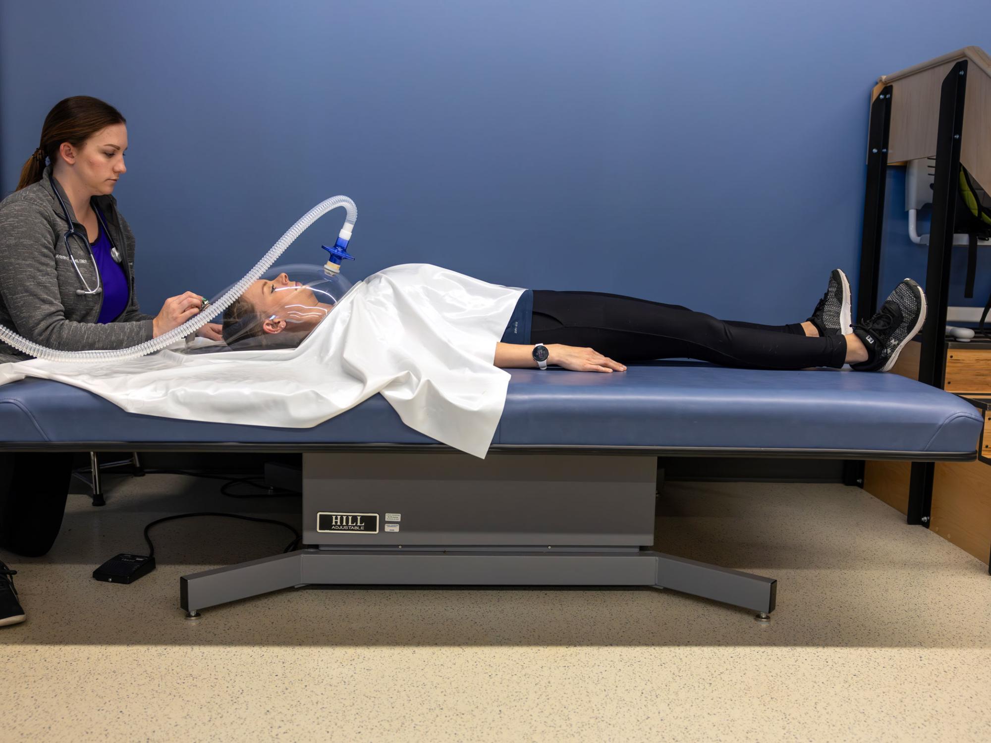 A patient is connected to the Resting Metabolic Rate system to measure energy expenditure