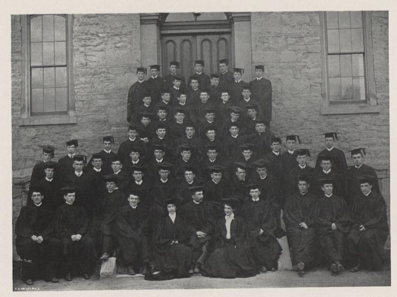 A group of graduates in caps and gowns in 1903