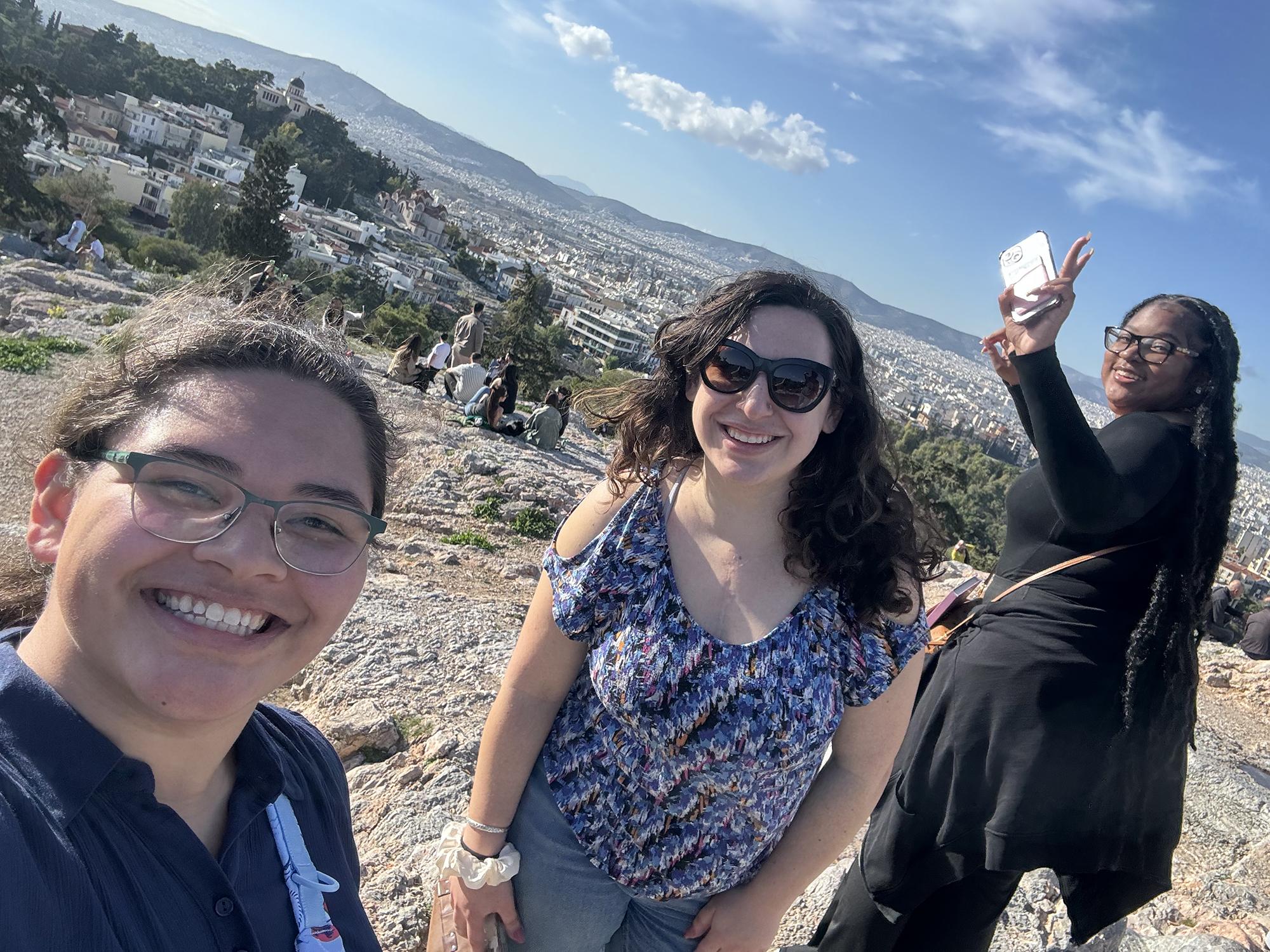 Hunter Markel (left) with Marissa Cruz (middle) and Cameryn Allen (right) stand on the Areopagus Hill in Athens, Greece.