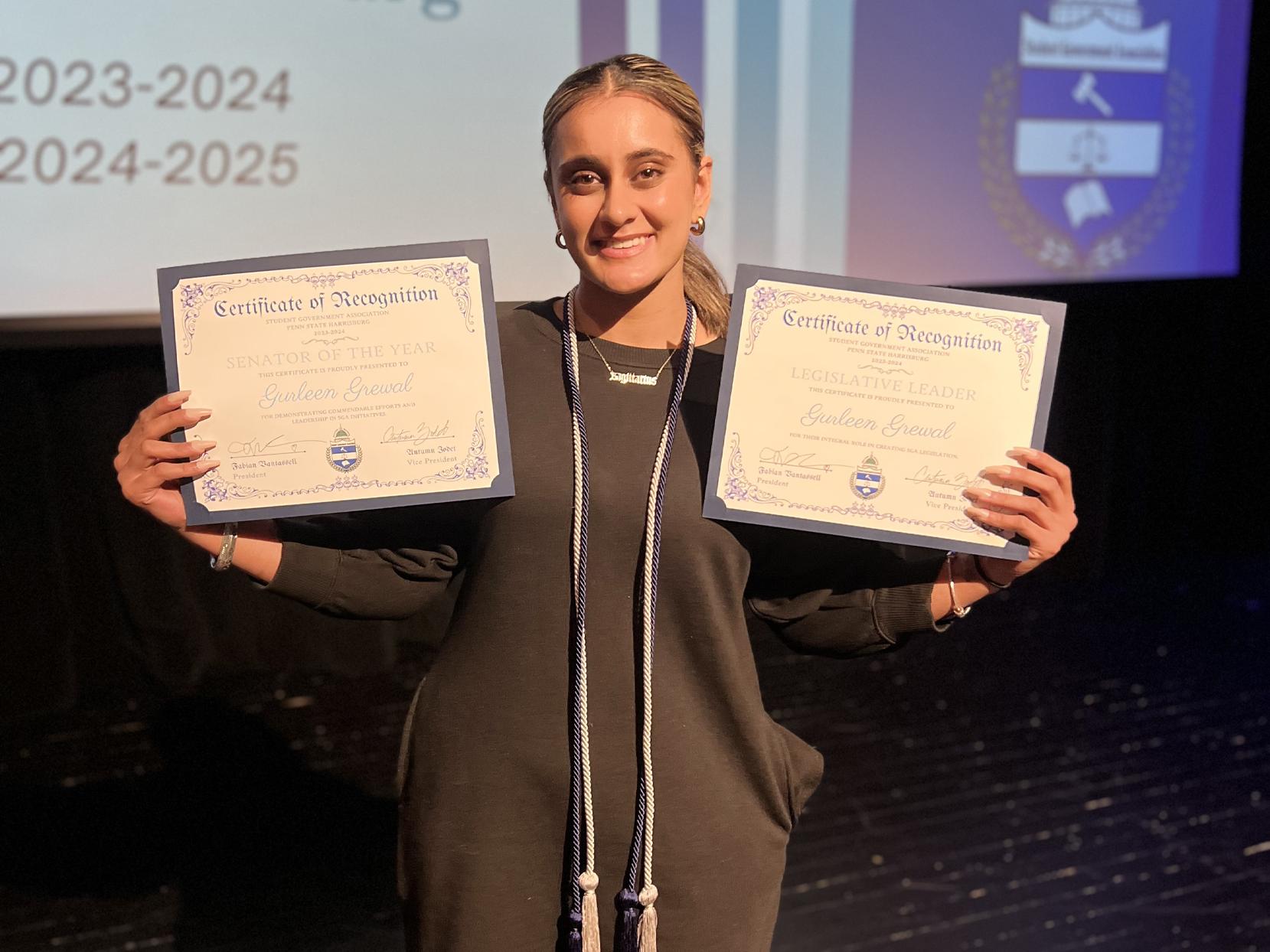 Gurleen Grewal holds awards she received for her work in student government