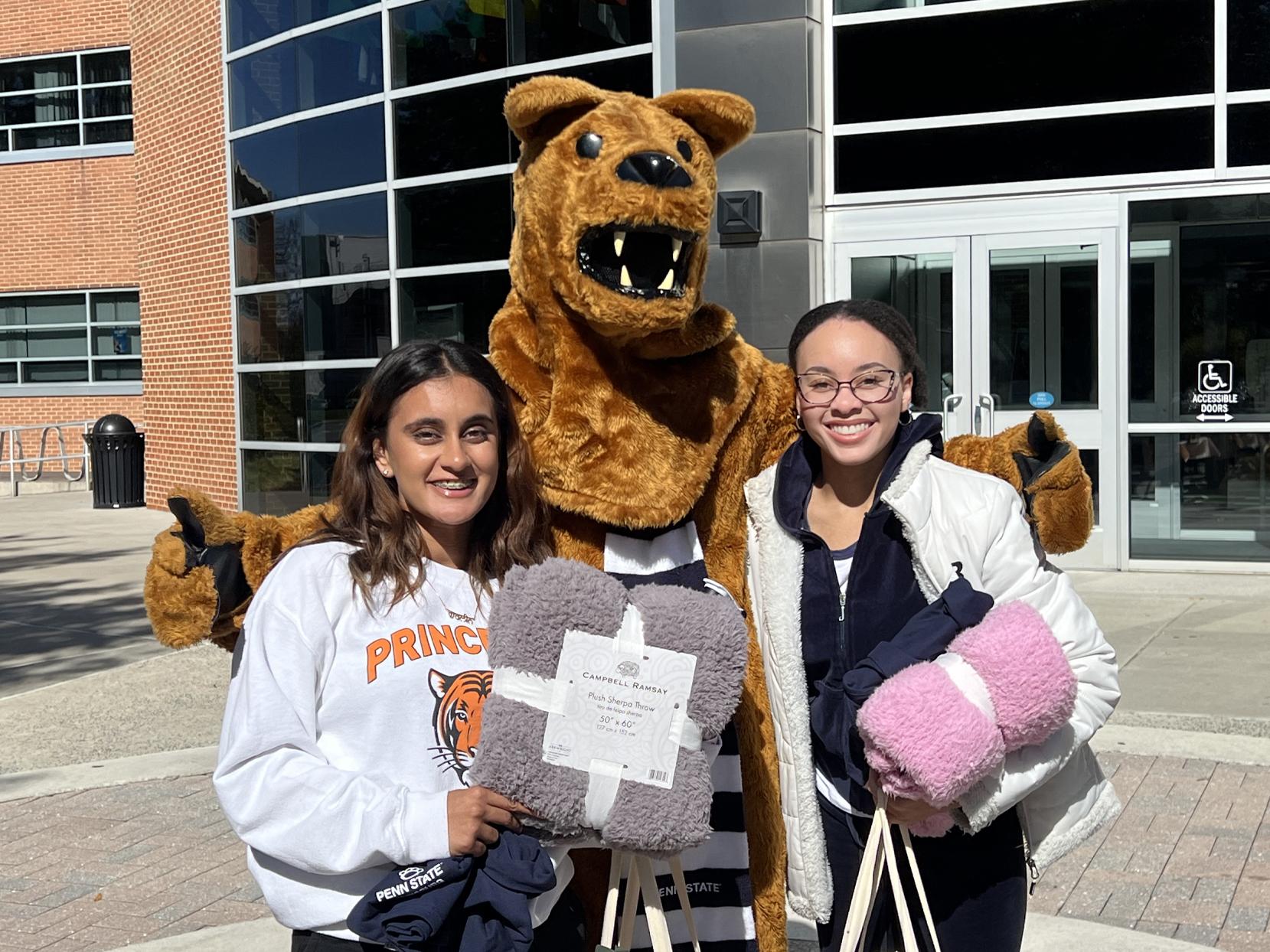 Gurleen Grewal and a friend pose with the Nittany Lion on the Harrisburg campus