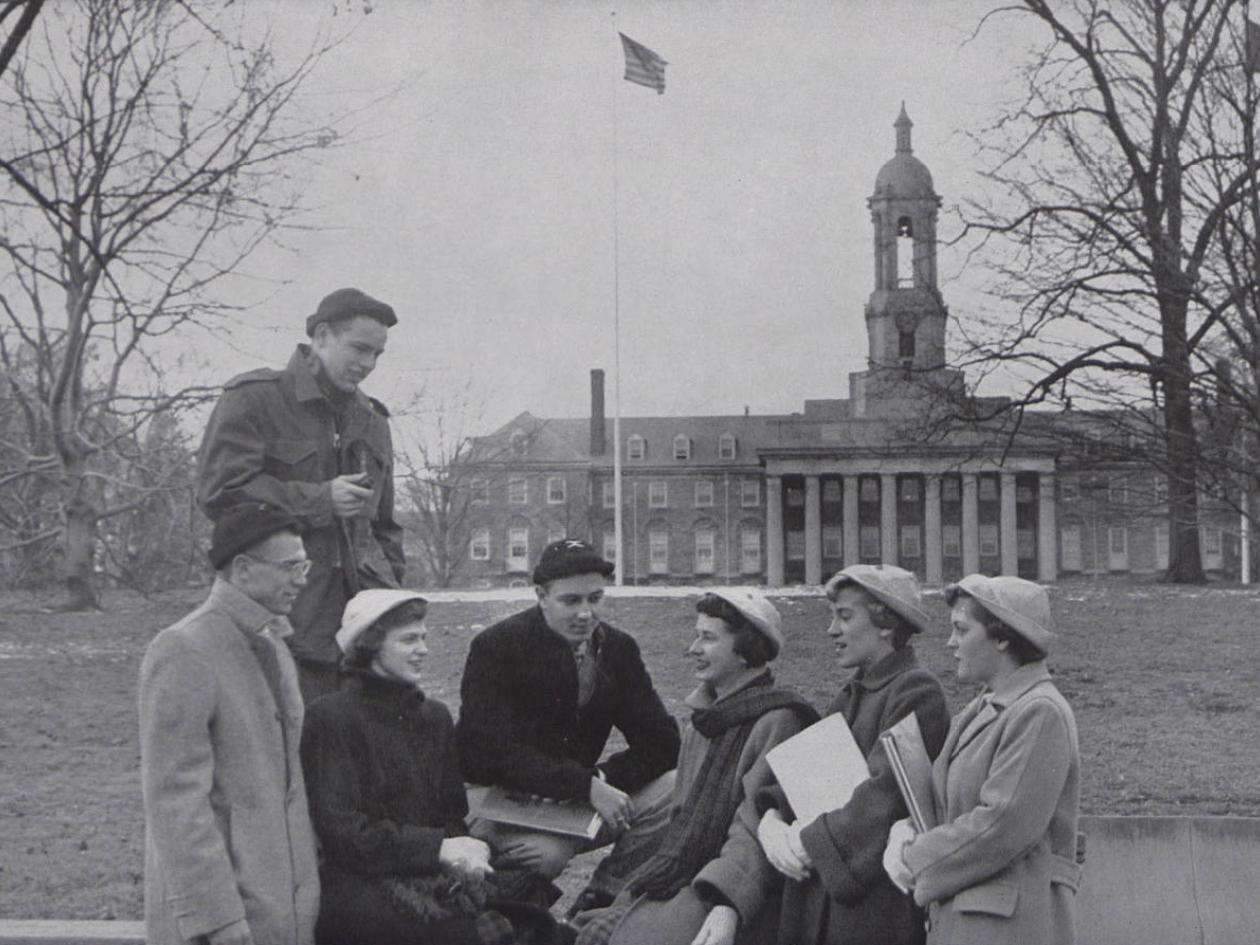 A group of students with Old Main in the background