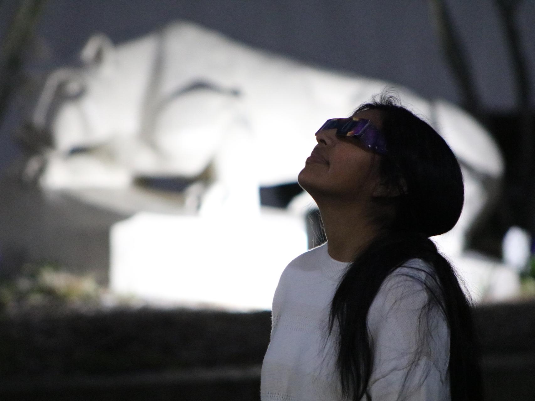 Silhouette of a student watching the total solar eclipse