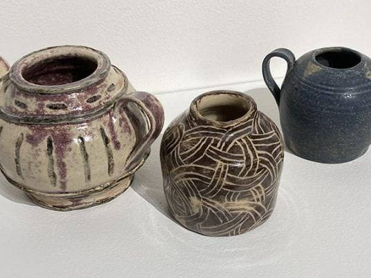 Three ceramic handled pots