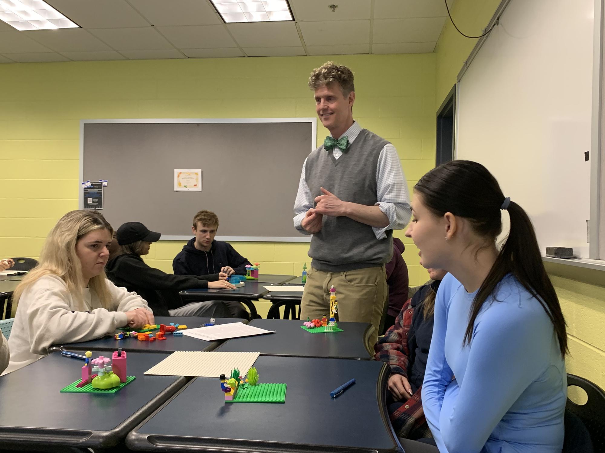 Associate Professor Michael Tews talking with students