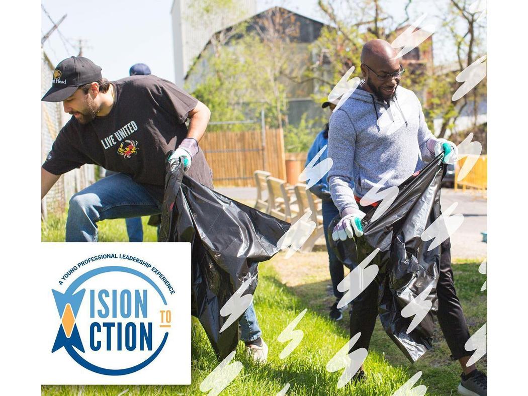 Beresford Pratt, at right, and another volunteer clean up trash at a park. 