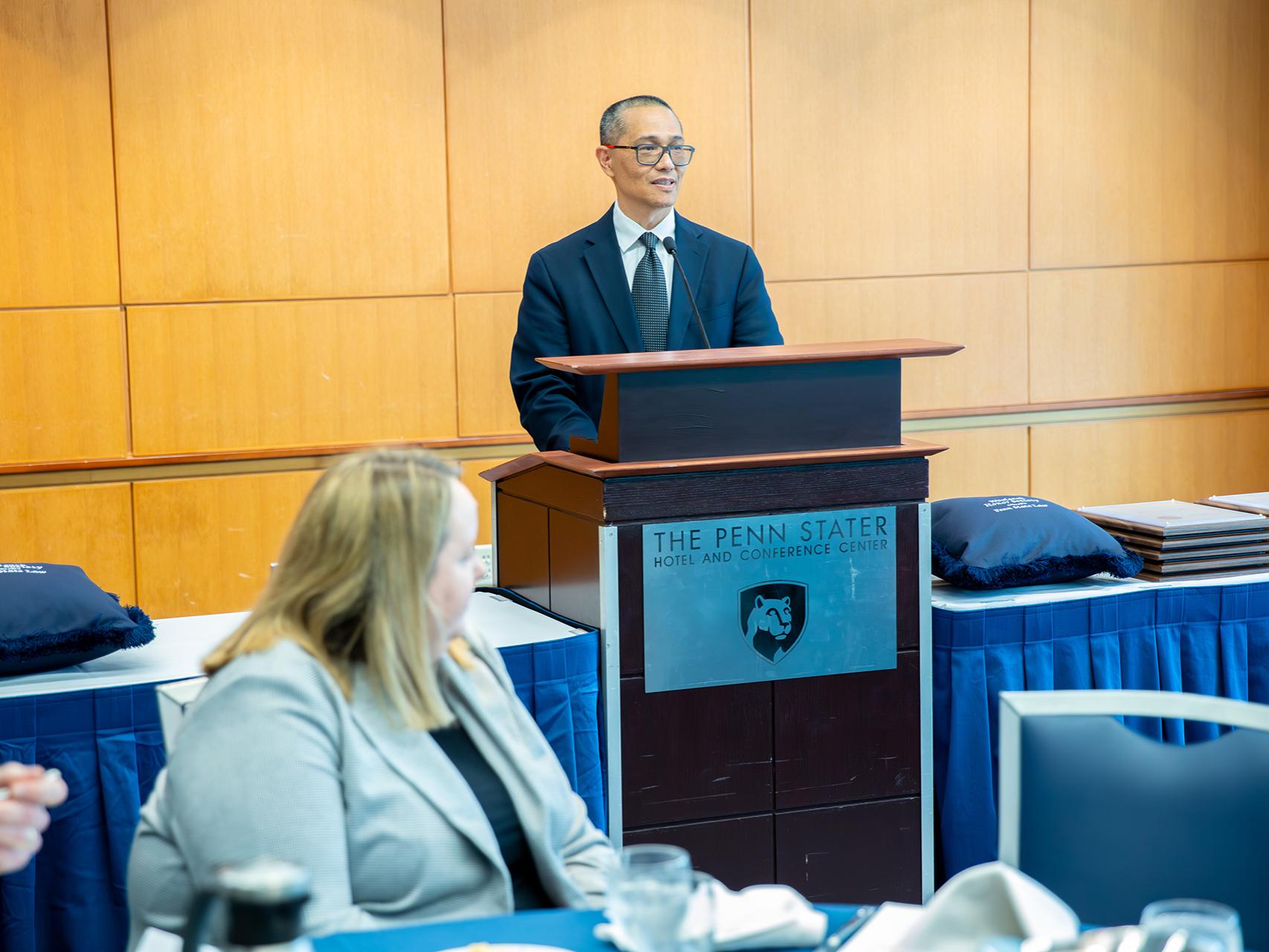 Interim Dean Victor Romero delivering remarks at the Woolsack luncheon
