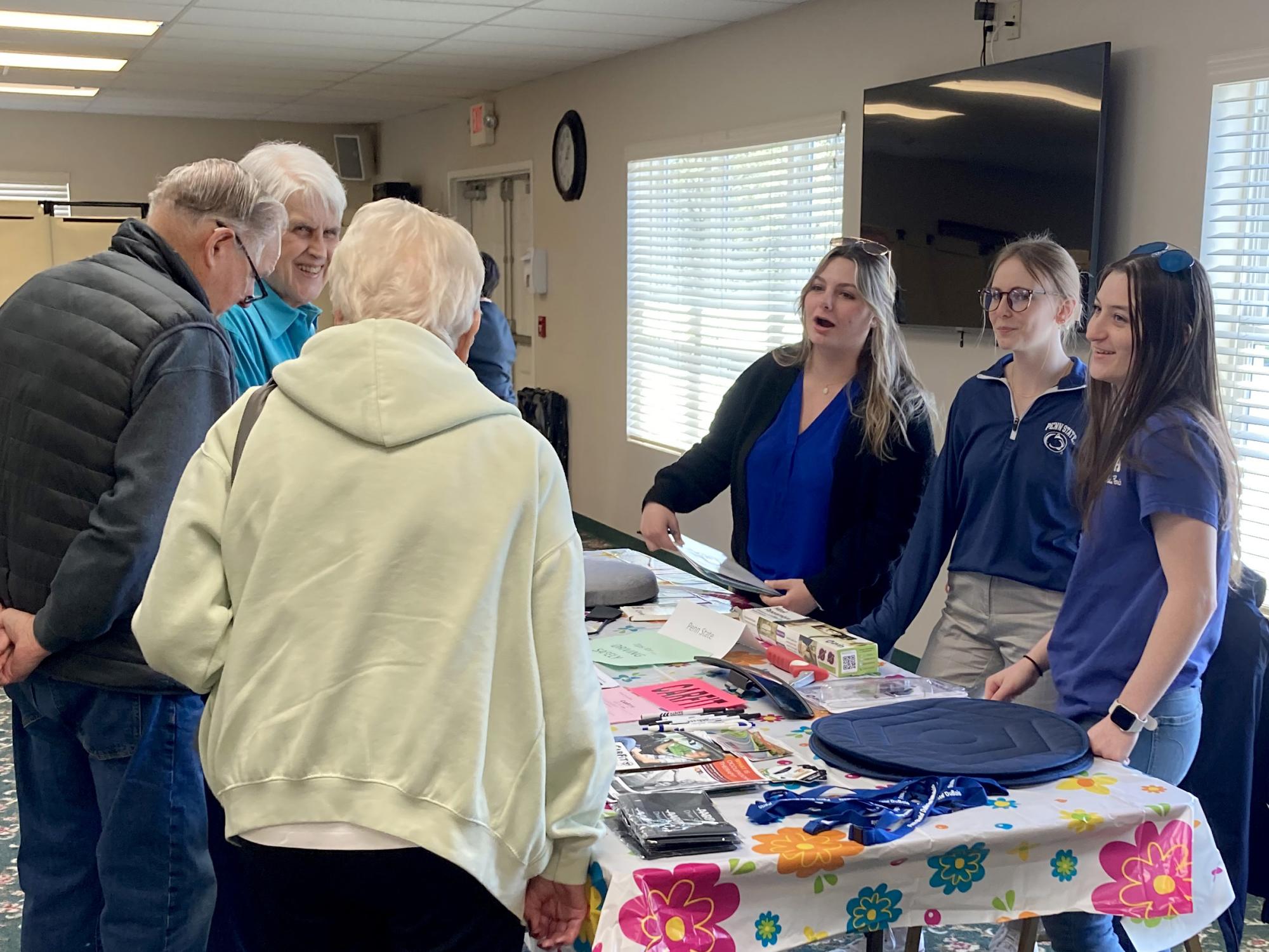 Penn State DuBois OTA students share information during the health and wellness fair at Christ the King Manor on April 25. Students, from left to right, are Emily Busija, Fiona Riss and Maddie Barsh.