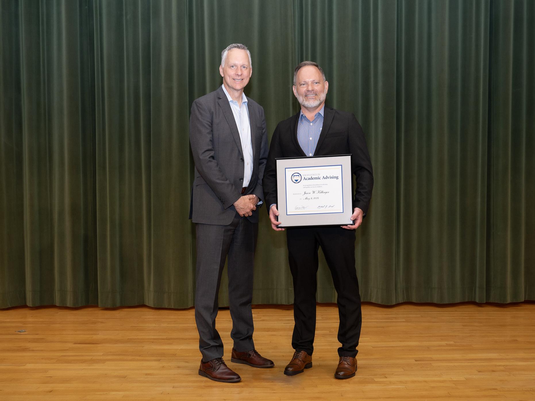 A person accepting an award from another person