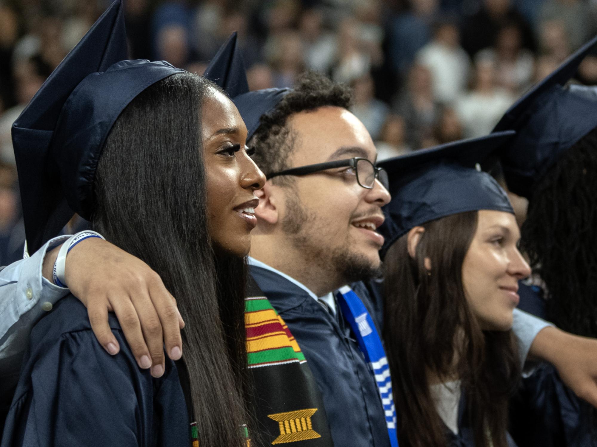 graduates singing alma mater