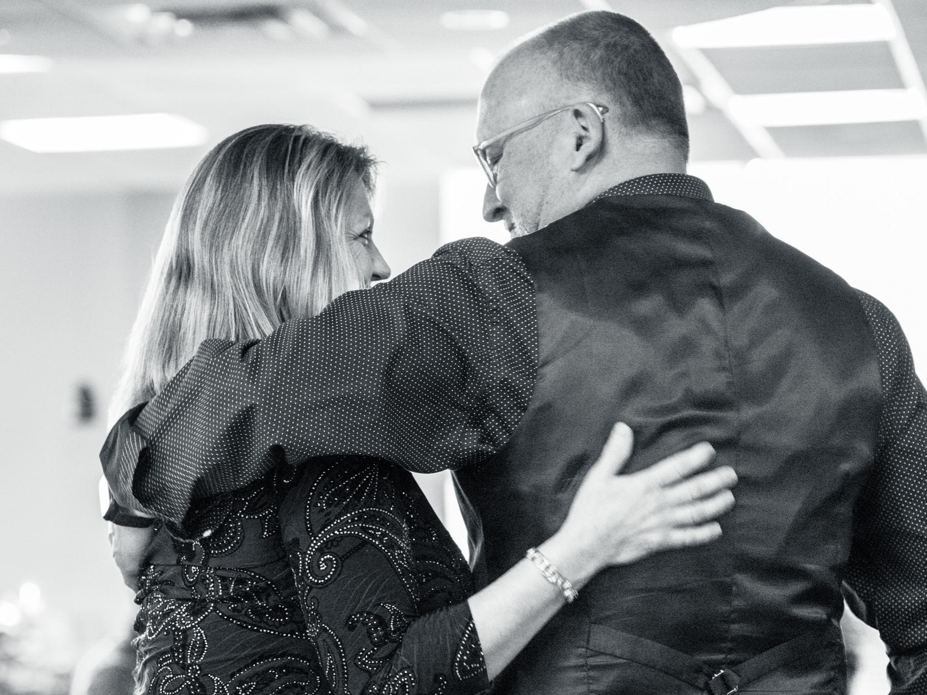 W. Charles Patrick and Billie Jo Yuhaniak hugging each other.