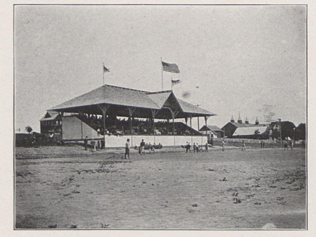 A picture of a football field with a grandstand c. 1899