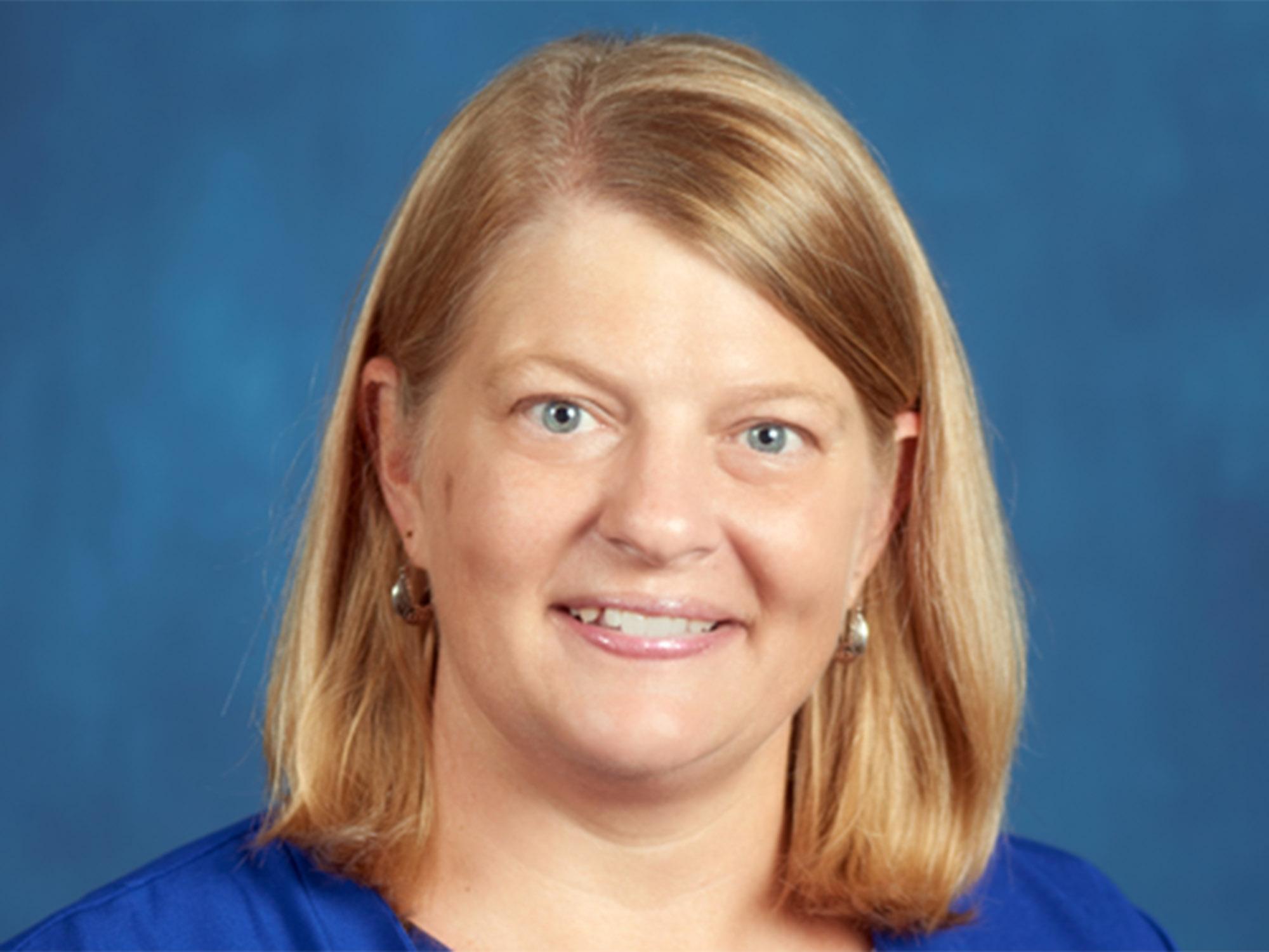 a headshot of Beth Ann White