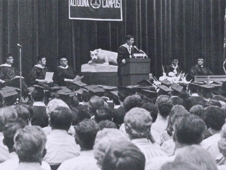 A wide shot of graduates and guests at commencement 