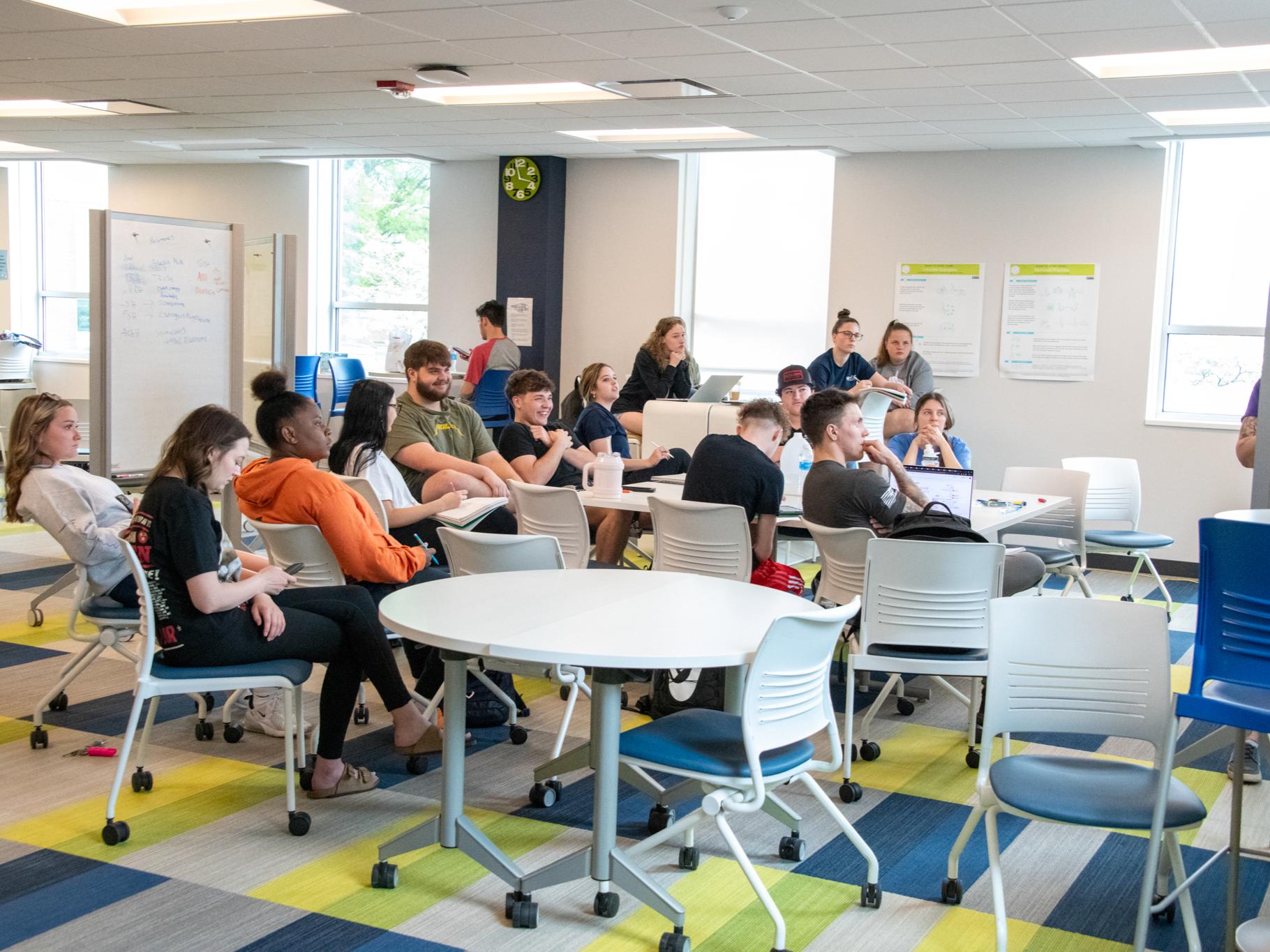 A large group of students sitting in the Student Success Center.