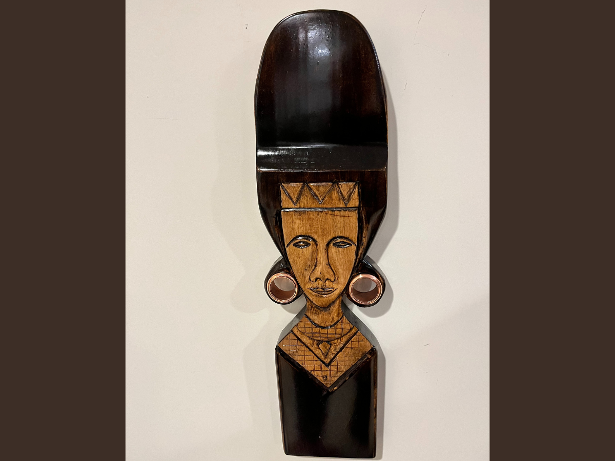 Finished wood carved art piece of a Masai warrior from east Africa