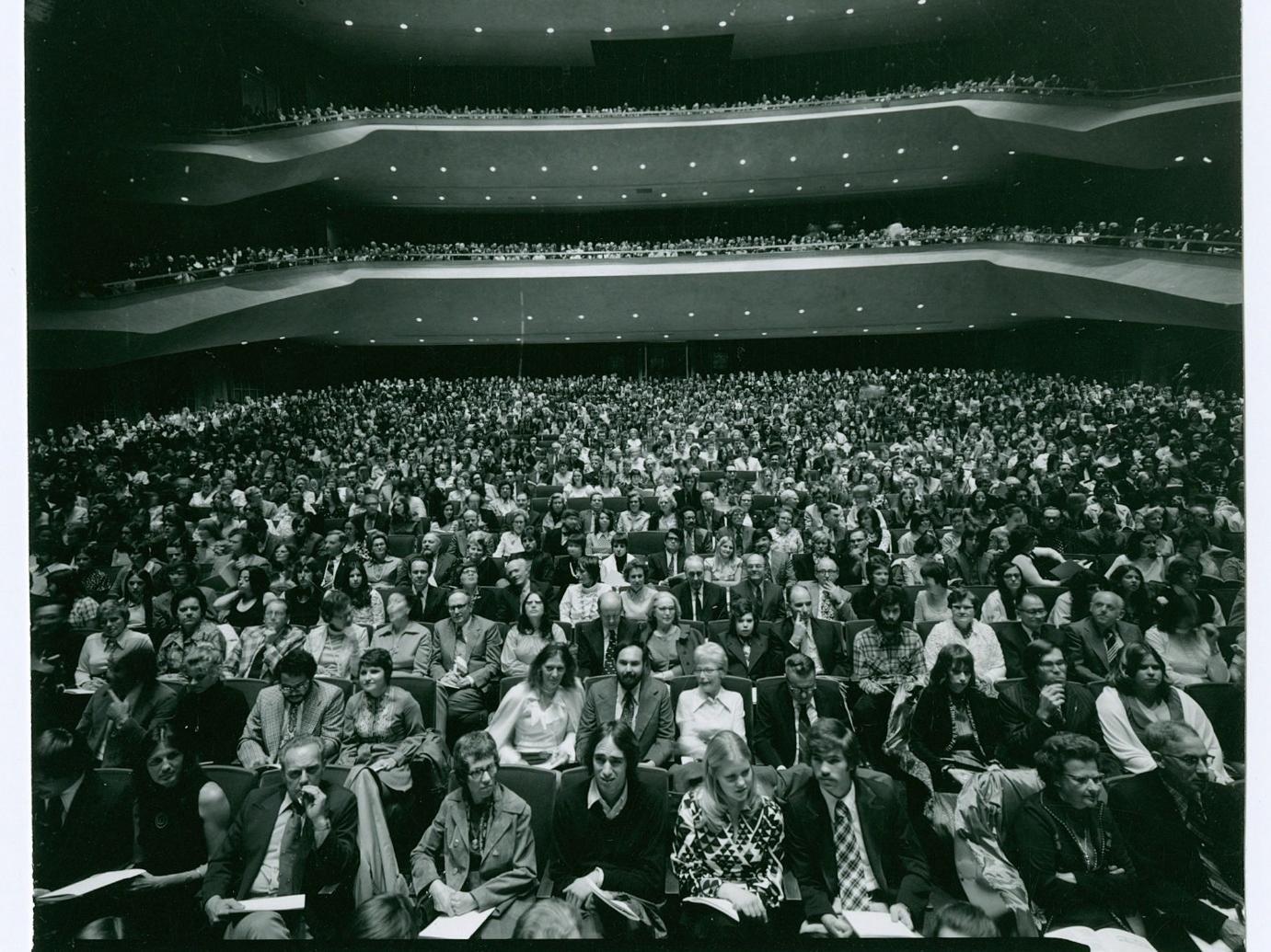 A large audience in an auditorium