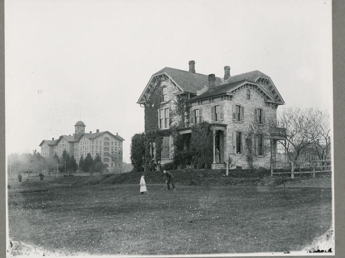 A black and white picture of a residence on a college campus in the 1890s