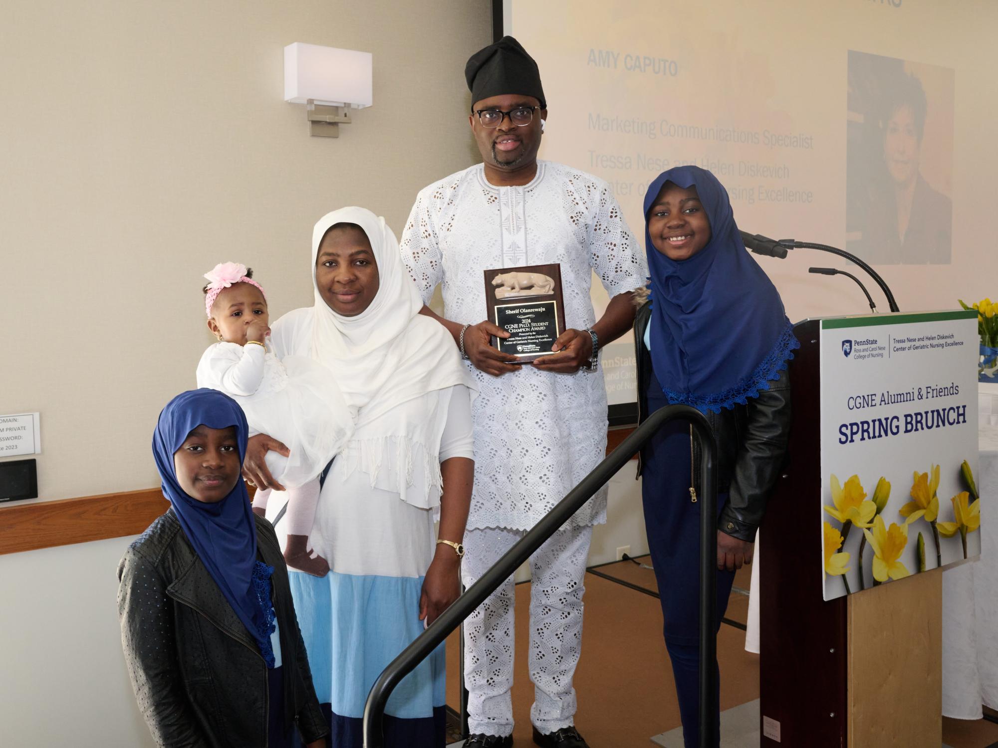 CGNE Ph.D. Student Champion Award recipient Sherif Olanrewaju celebrates with his family.