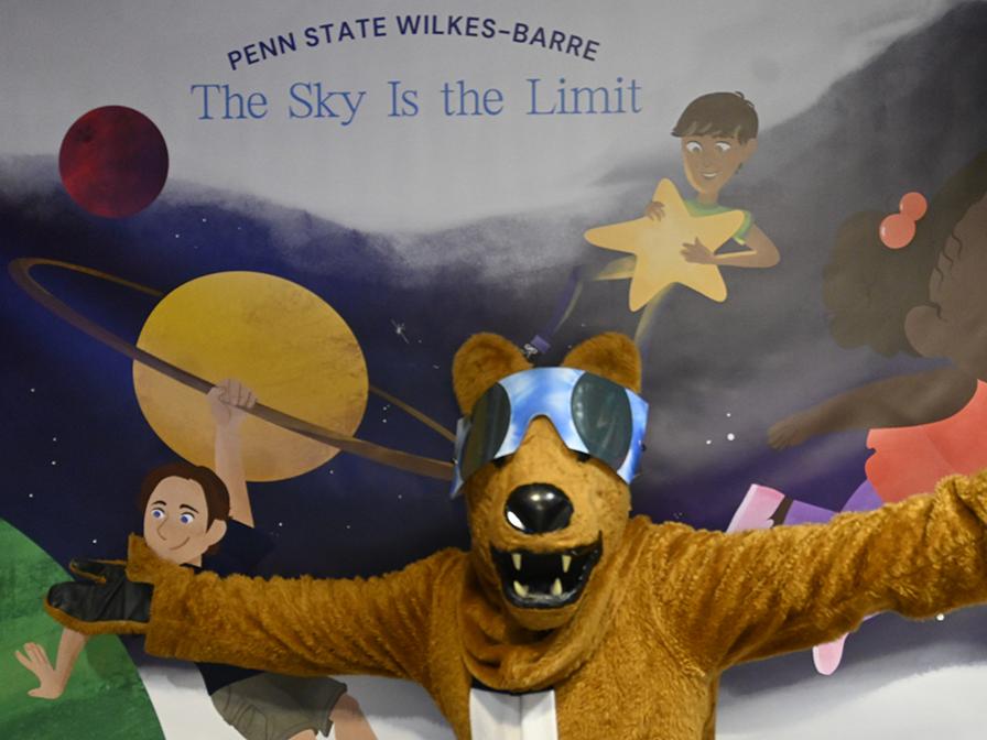 The Nittany Lion mascot wearing solar eclipse glasses.