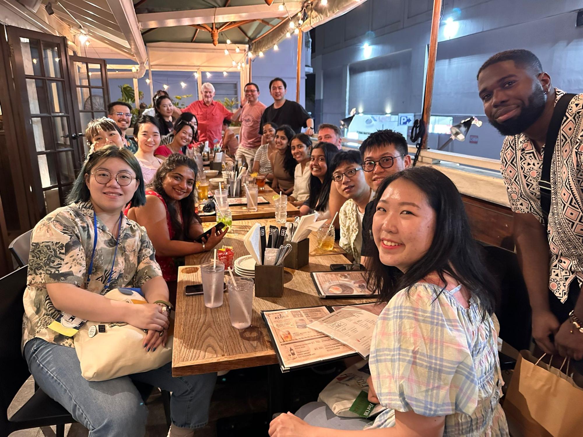 group of people around a restaurant table