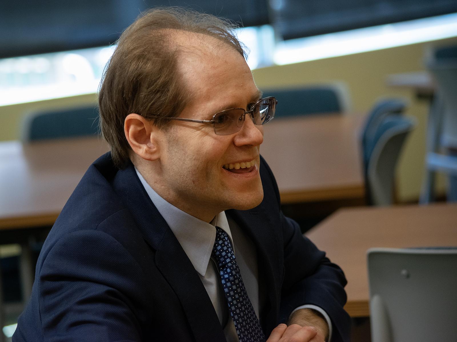 Daniel Boustead, who received a master's degree in American studies from Penn State Harrisburg, smiles during a luncheon