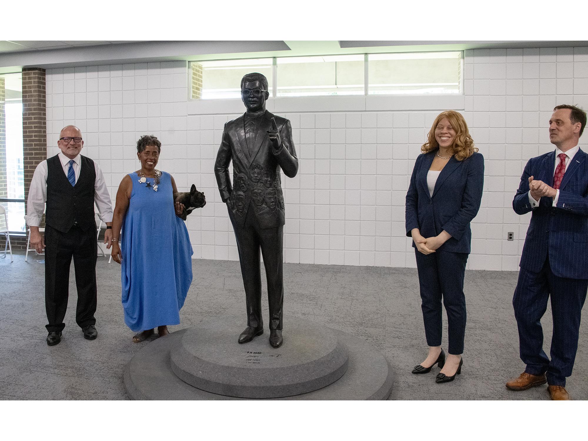 (From left) W. Charles Patrick, Vinnie Bagwell, SeriShia Chatters, and Robert Eberly III stand beside the statue of the Rev. James Lawson Jr.