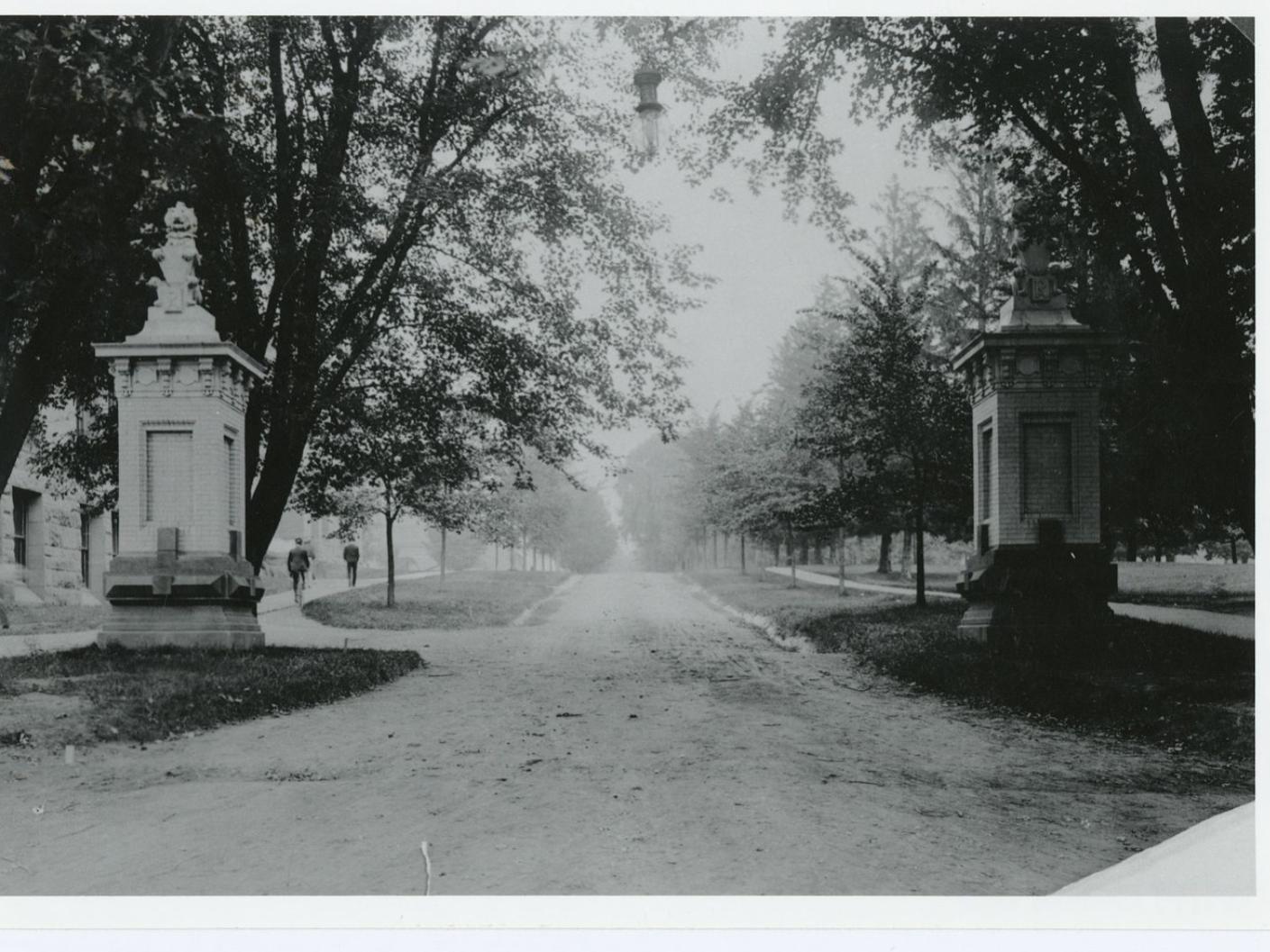 The main entrance to campus, sometime between 1905 and 1916. The statues of “Ma” and “Pa” lions can be seen at the top of each pillar.