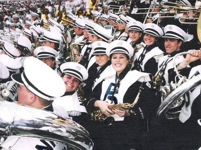 Penn State Blue Band members in the stands at a football game