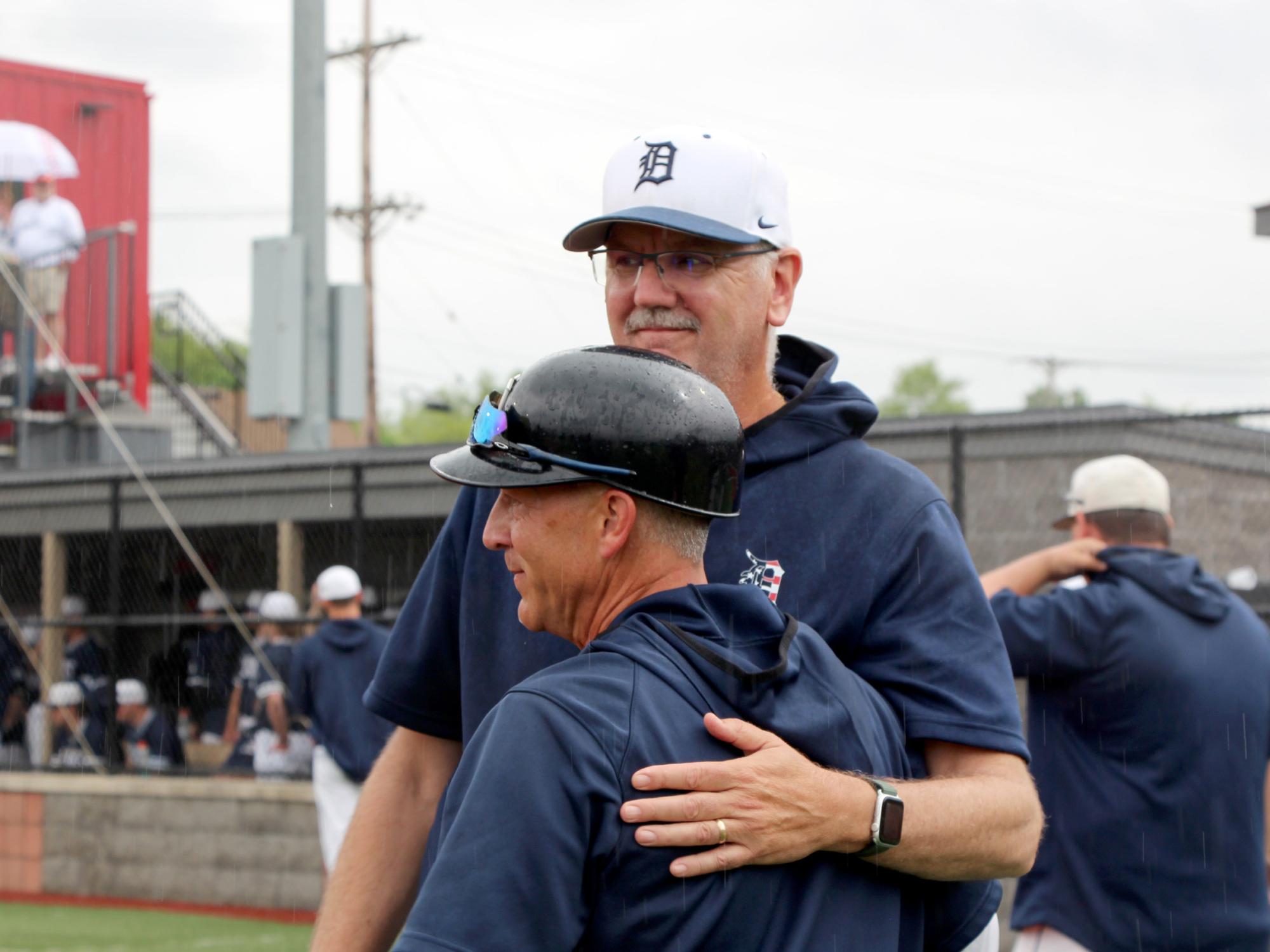 Former Penn State DuBois baseball head coach Tom Calliari, front, embraces long time assistant coach Mike Nesbit following a game during the 2024 USCAA Small College World Series.