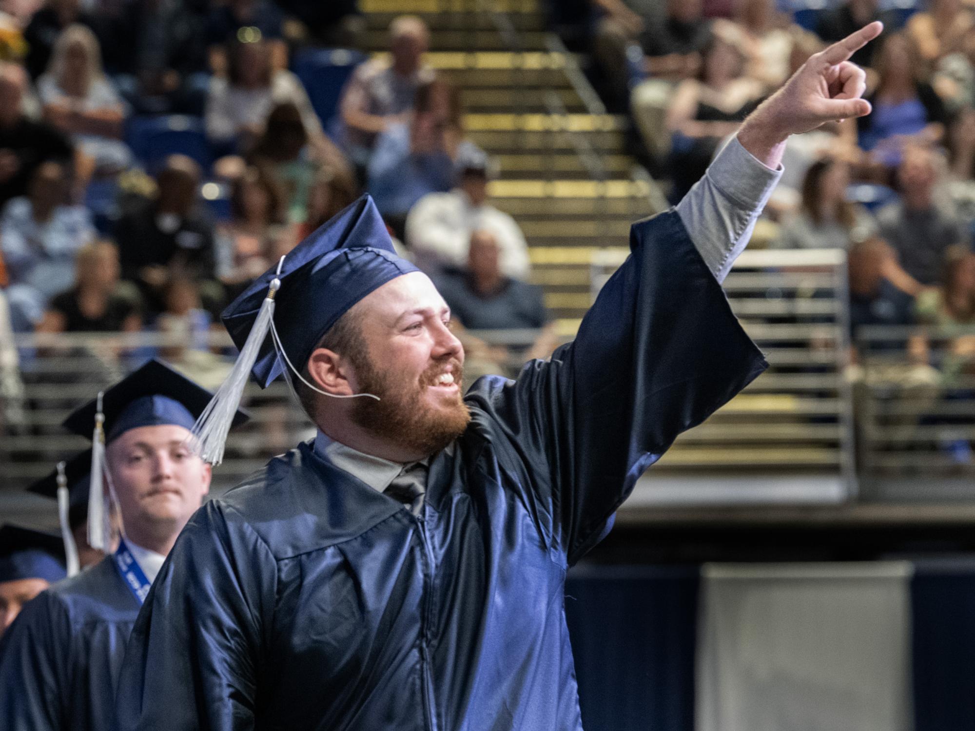 graduate walks across stage