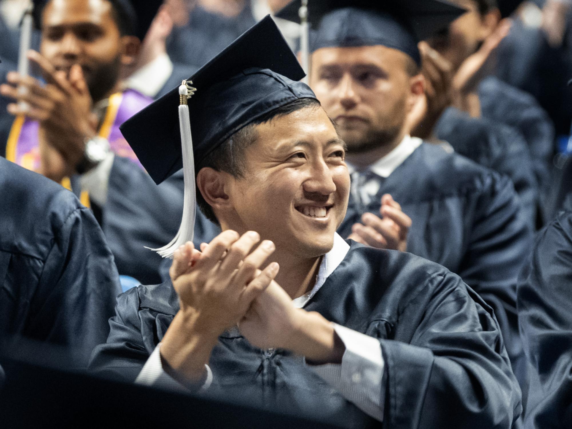 applauding family at commencement