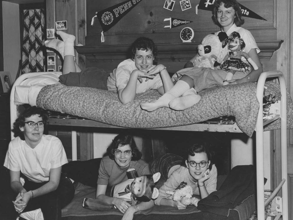 Five students posing on bunk beds