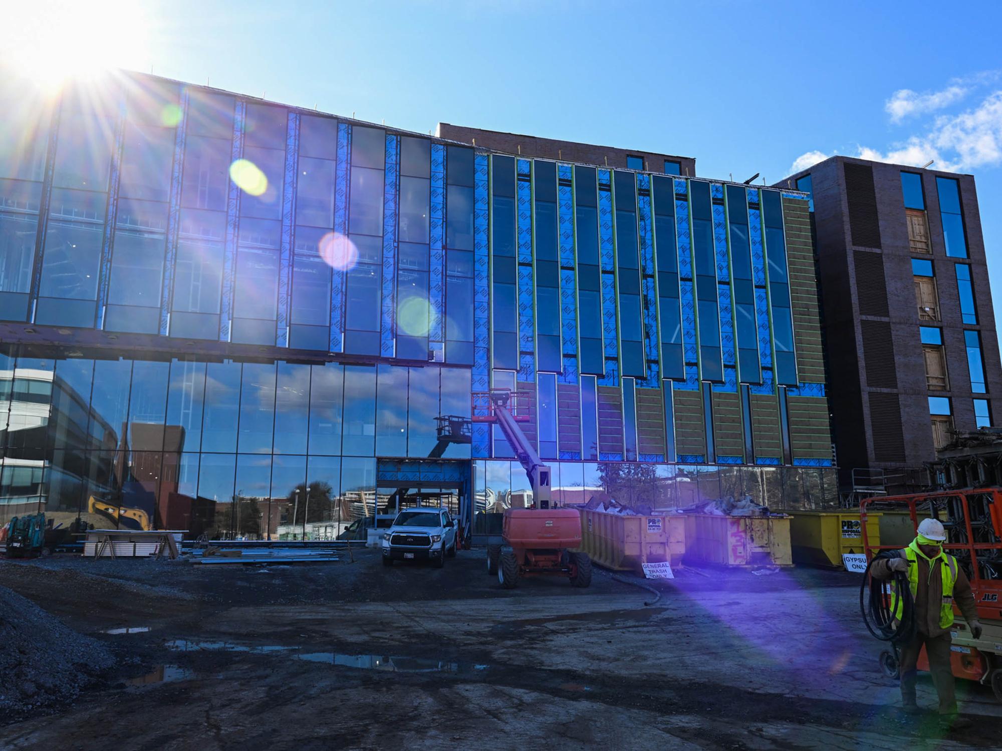 exterior shot of building under construction and equipment