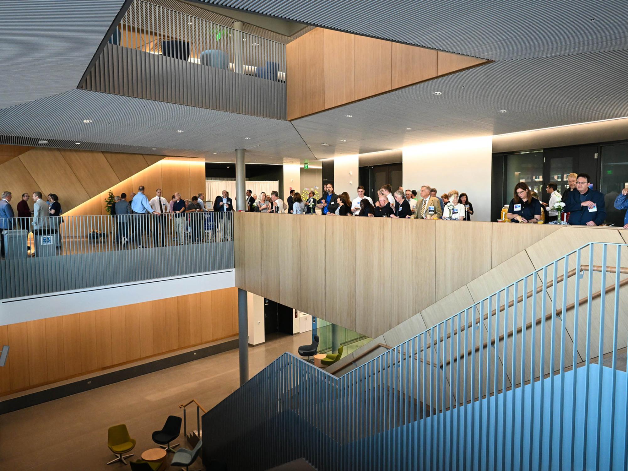crowd of people inside atrium of new building