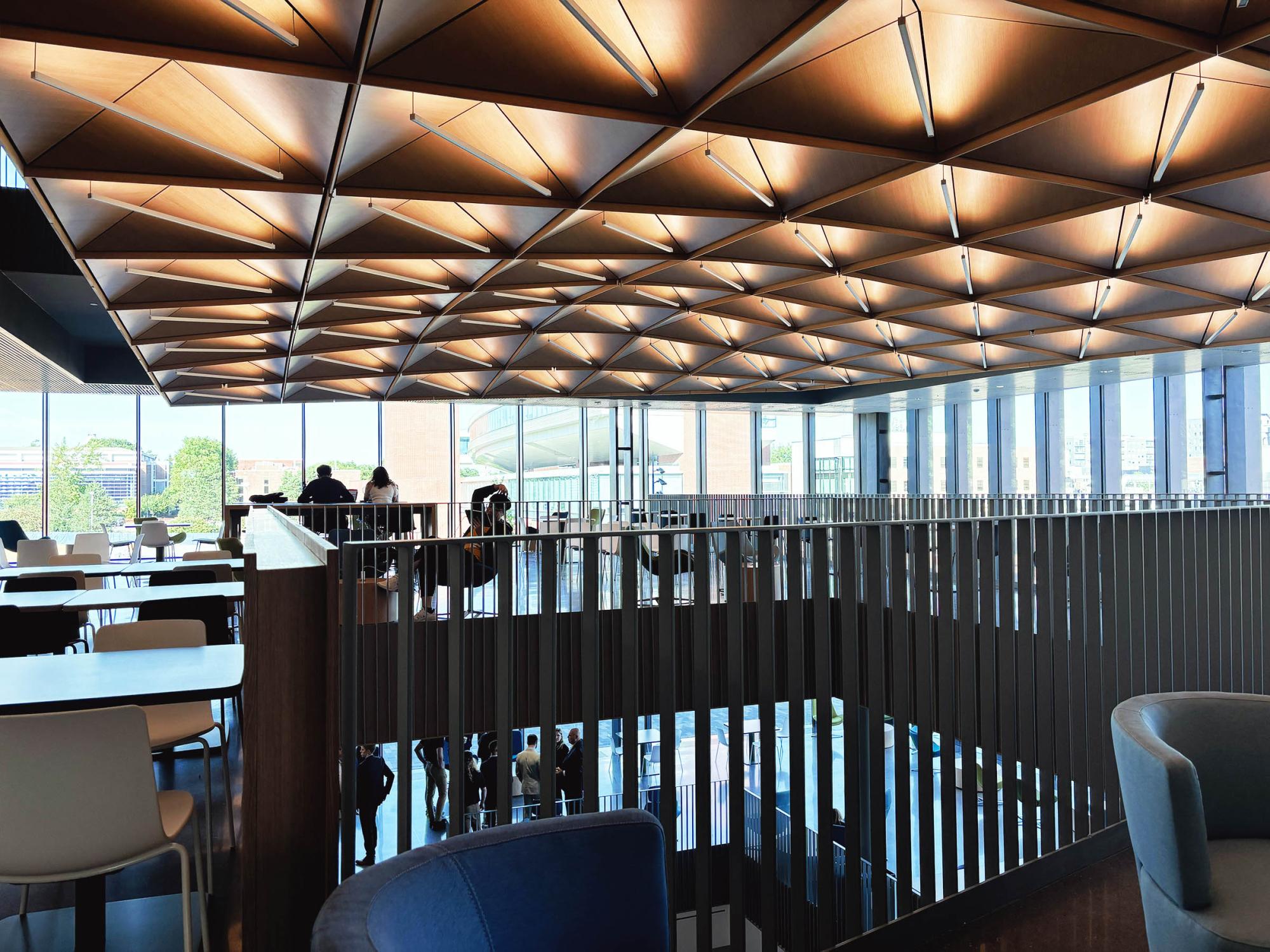 interior shot of second floor of new building with noise-suppressing ceiling made with special wood panels