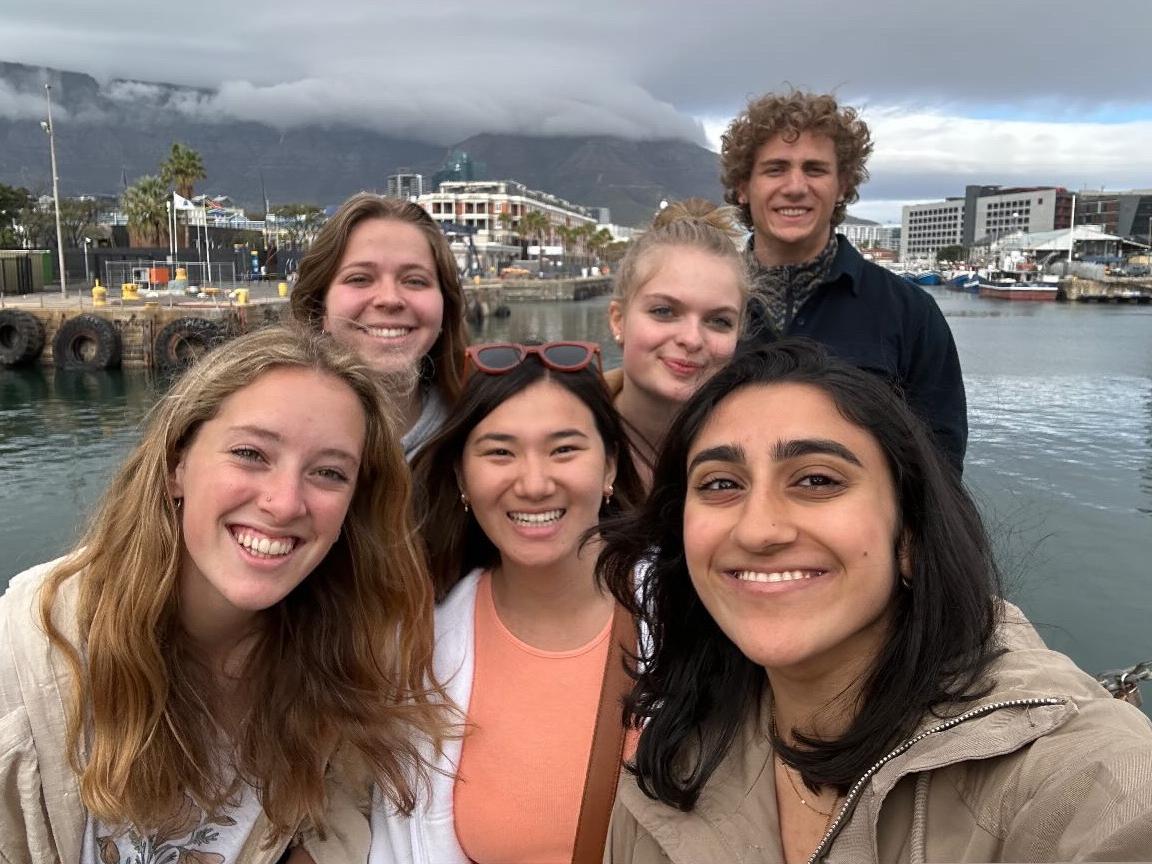 Six Penn State students pose for a selfie in front of the Waterfront in Cape Town, South Africa.
