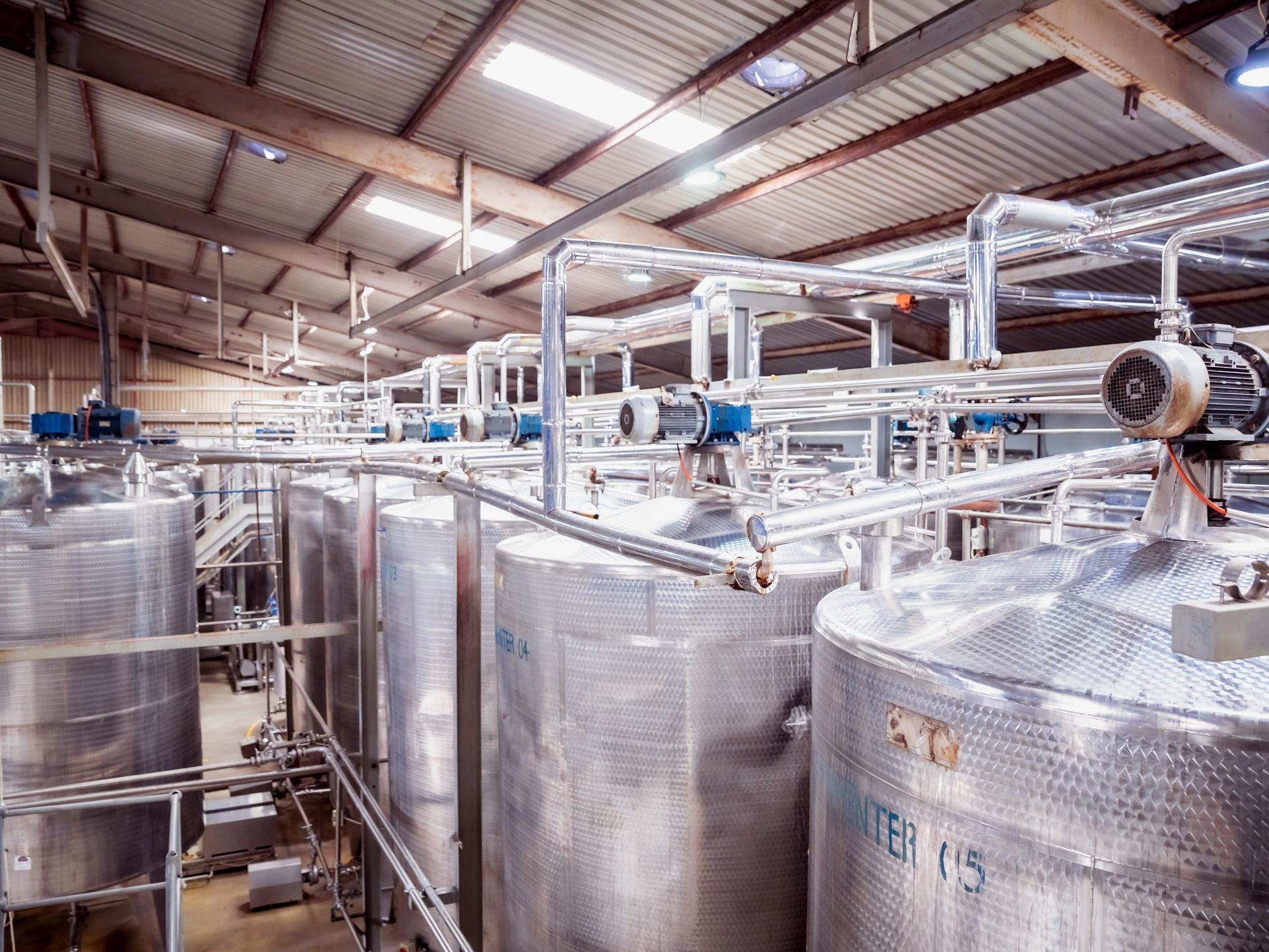 Dairy tanks in a warehouse