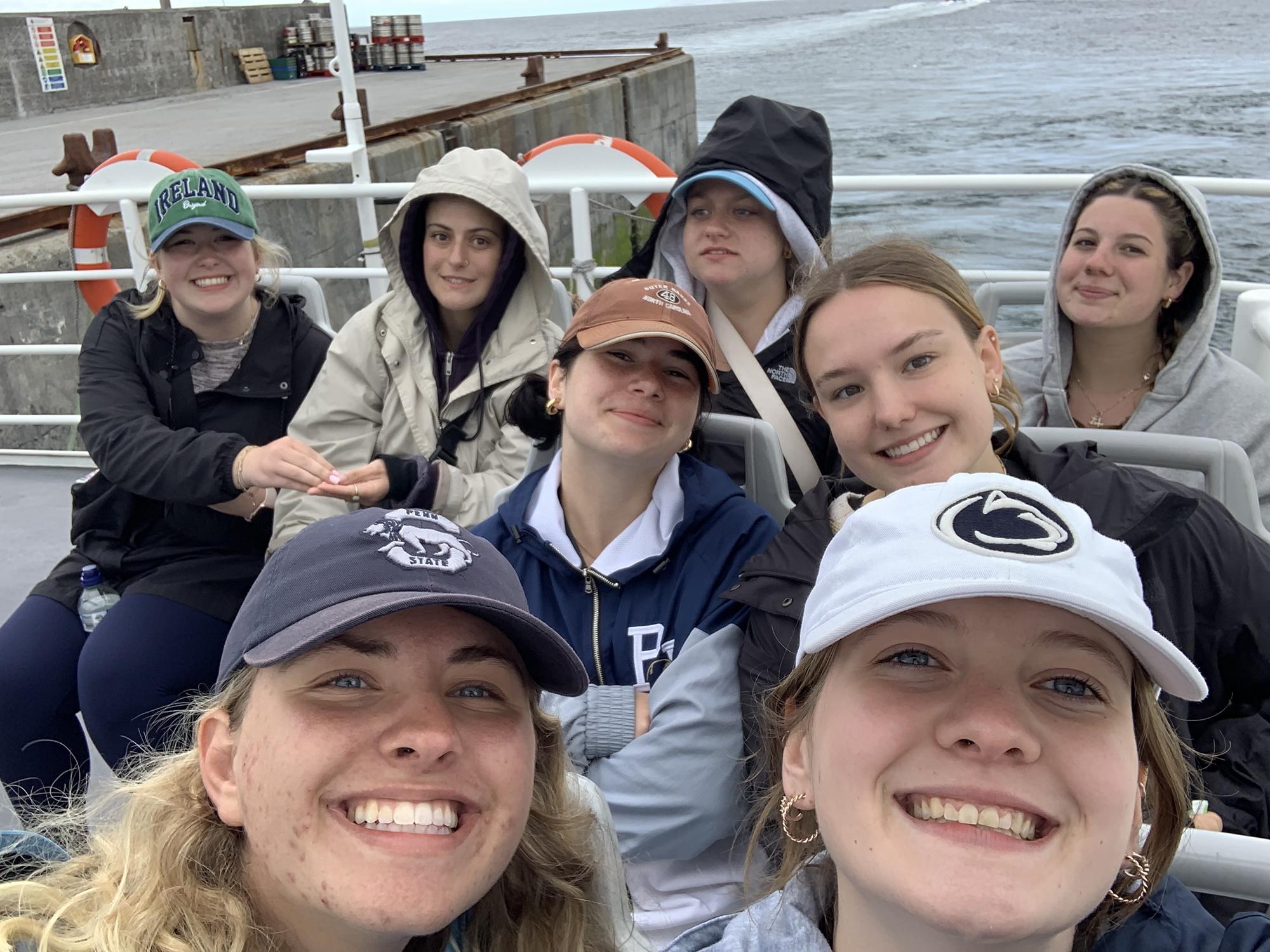 Penn State students smiling for a picture while on a boat ride in Ireland.