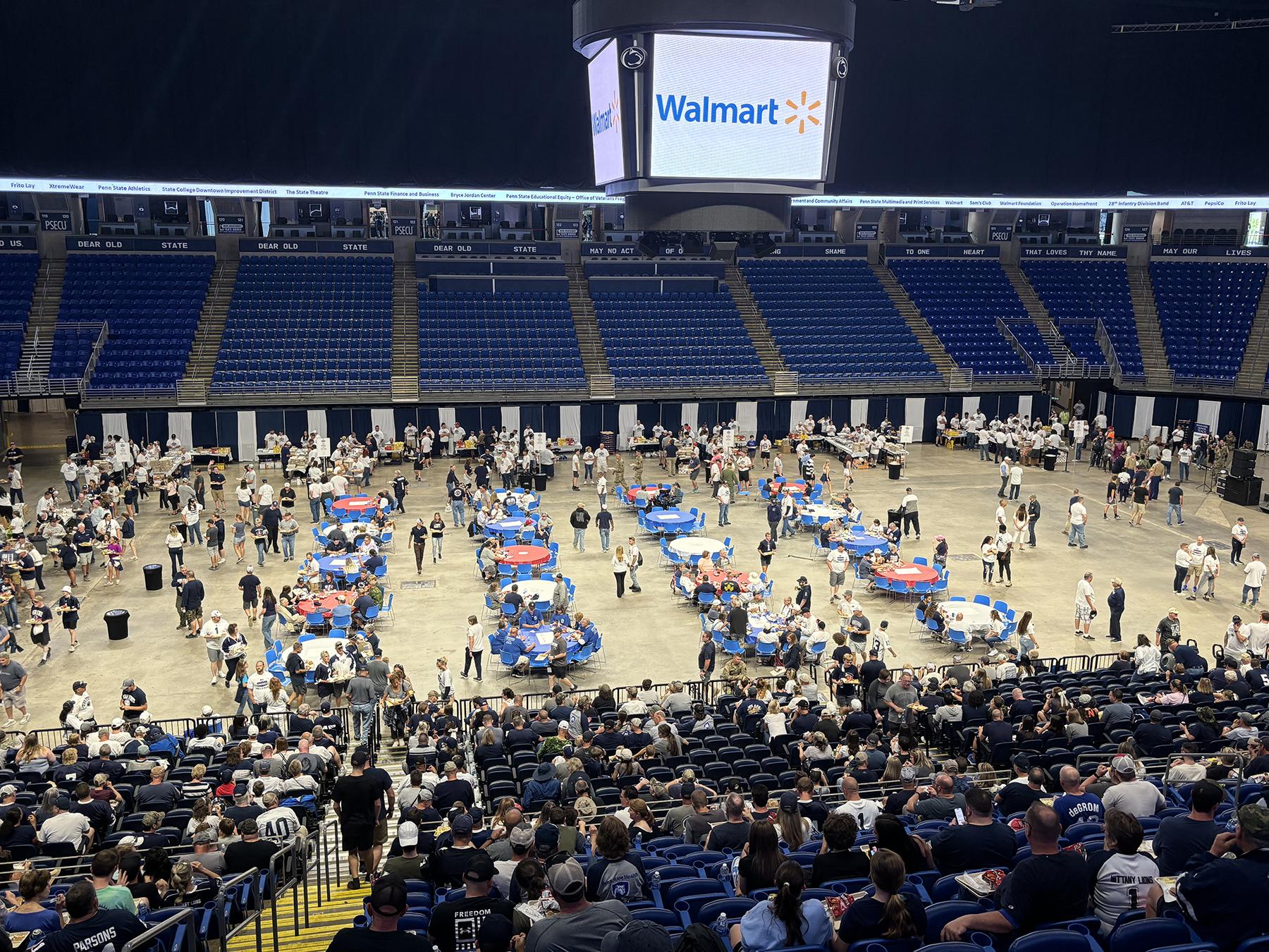 A crowd of people inside an arena.