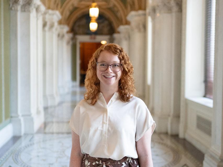 Julia Welp stands in a hallway in the Library of Congress for her summer internship. 