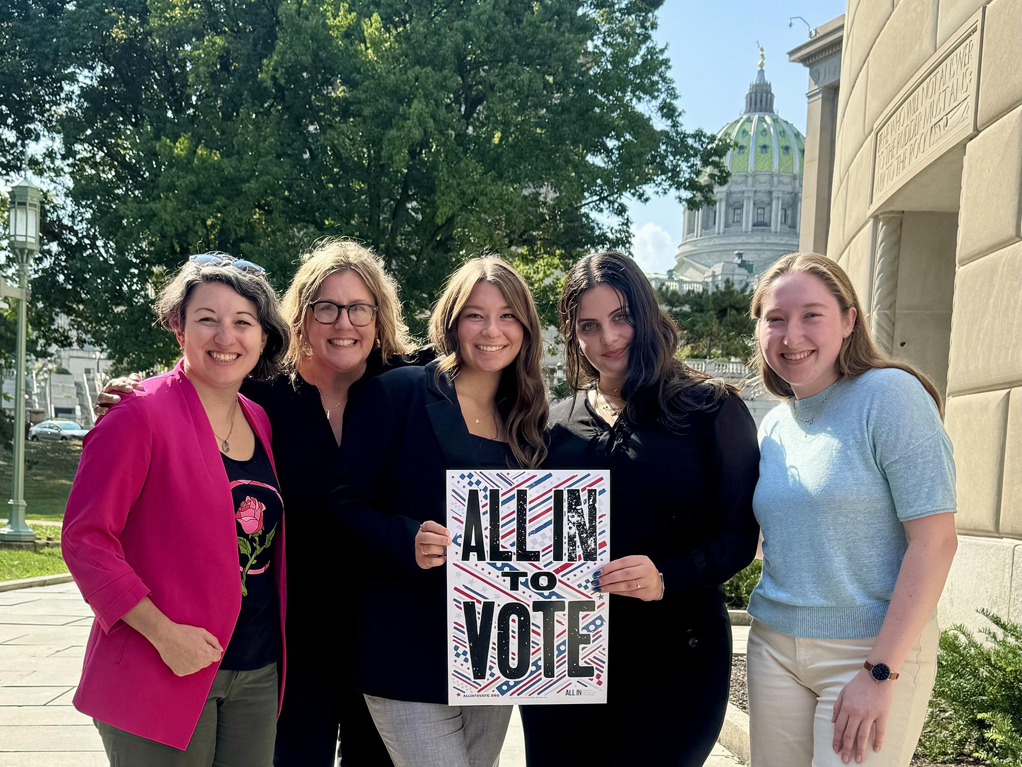 Maddie Hindman (far right) stands outside the Forum Theater in Harrisburg, Pennsylvania, with four other people at the Pennsylvania Youth Voting Summit.