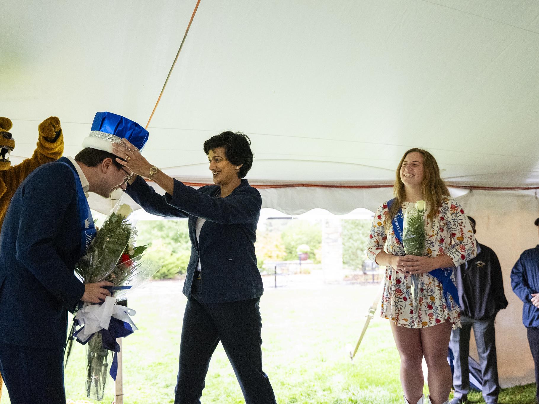 Chancellor Pyati crowns a student on stage