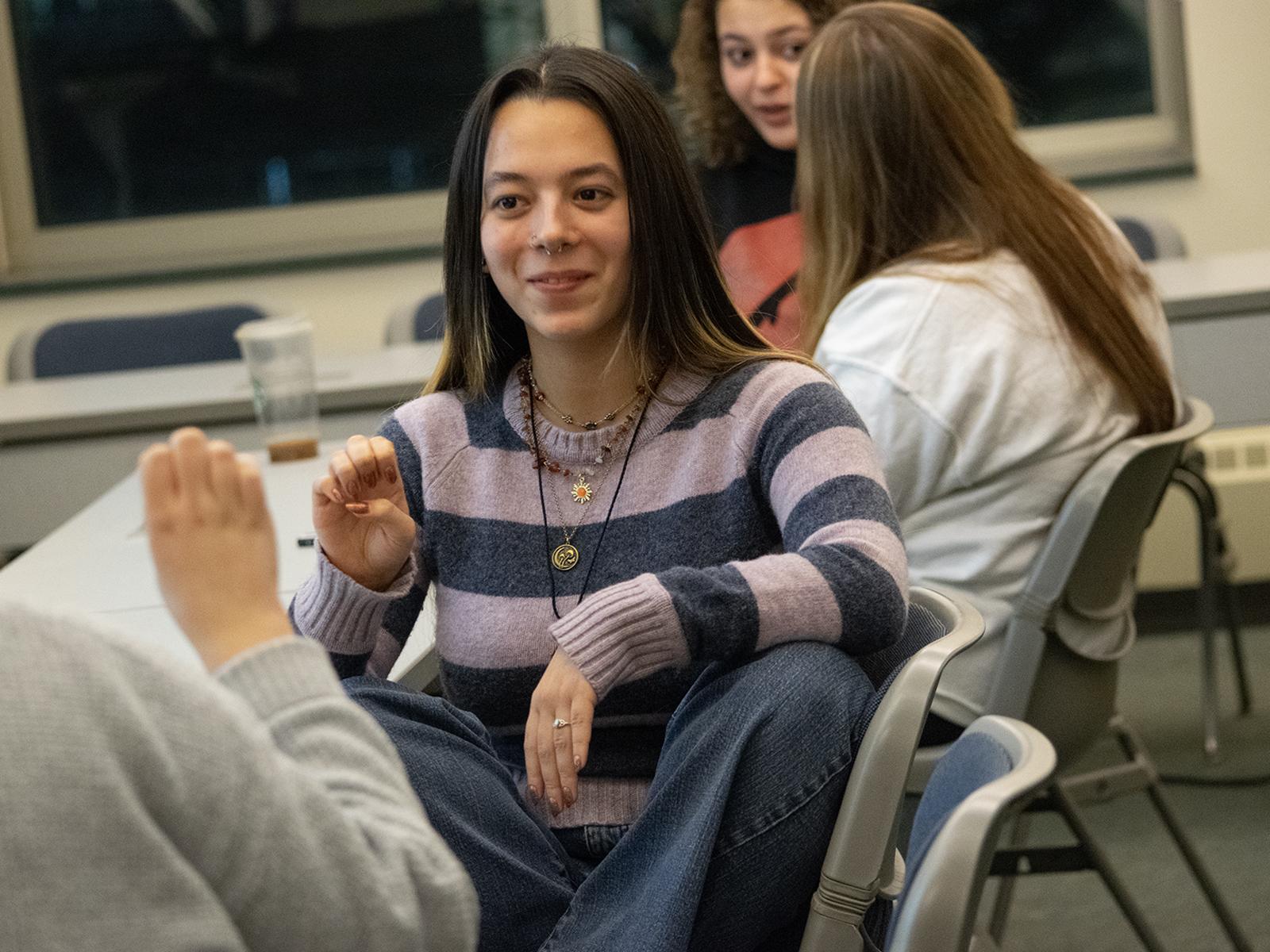 Students practice sign language in class