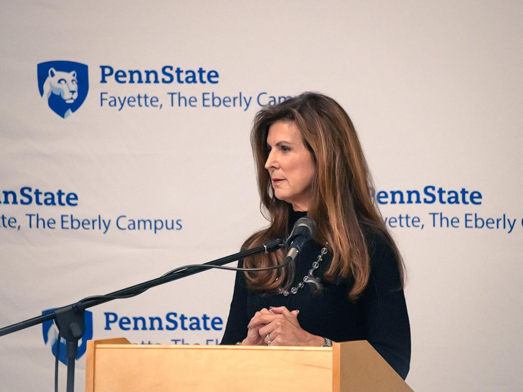 Paula Congelio, Vice President of Finance and Chief Financial Officer at West Virginia University, standing at the podium of Penn State Fayette’s 15th annual Scholarship Donor Dinner. 