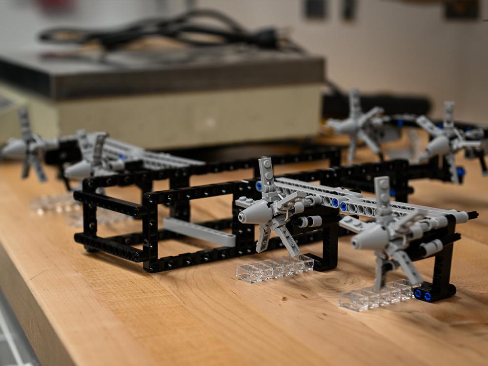 A black and white LEGO model of a vertical flight vehicle.