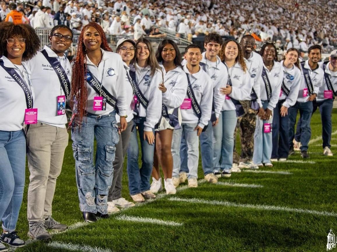 The 2024 Penn State Homecoming Court members stand in a line and pose for the camera